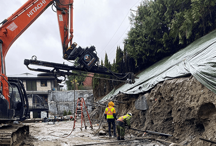 Excavator Crane With A Mounted Drilling Rig